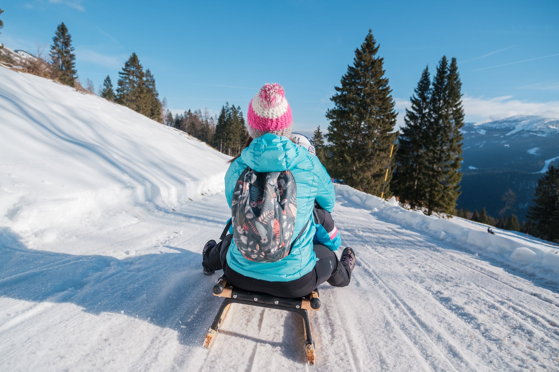 A woman and a child slide down the Pradel sledding slopes. | © Filippo Frizzera, 2022