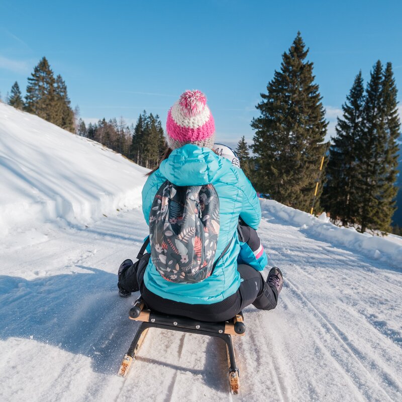 A woman and a child slide down the Pradel sledding slopes. | © Filippo Frizzera, 2022