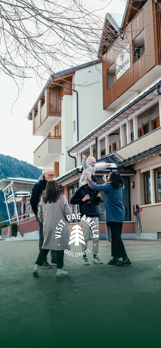 In the image: beatrice's entire family gathered in front of their hotel. In the text: A family business. | © Frame & Work, 2024