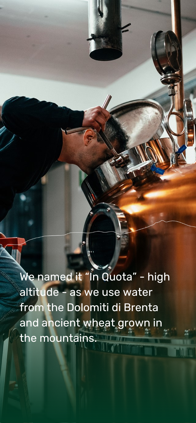 In the picture: Mauro of Villa de Varda checks the inside of the still. In the text: we named it "In Quota" - high altitude - as we use water from the Dolomiti di Brenta and ancient wheat grown in the mountains. | © Frame & Work, 2024